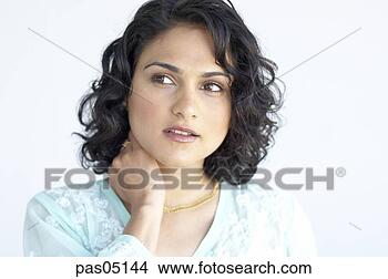 Stock Photo - indian woman rubbing 
her neck. fotosearch 
- search stock 
photos, pictures, 
images, and photo 
clipart