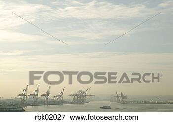Picture - industrial cranes 
on shoreline. 
fotosearch - search 
stock photos, 
pictures, images, 
and photo clipart