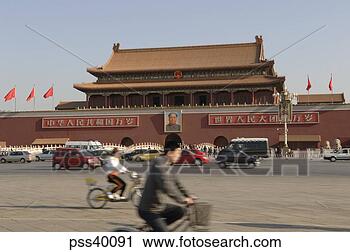 Stock Photography - large ornate asian 
building with 
bicyclists. fotosearch 
- search stock 
photos, pictures, 
images, and photo 
clipart