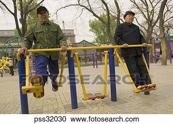 Stock Photography - low angle view 
of senior asian 
men at playground. 
fotosearch - search 
stock photos, 
pictures, images, 
and photo clipart