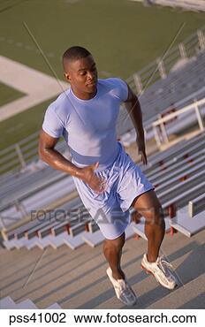 Stock Photo - male athlete climbing 
stadium stairs. 
fotosearch - search 
stock photos, 
pictures, images, 
and photo clipart