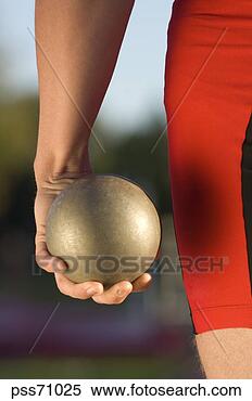 Stock Image - male athlete holding 
shot put. fotosearch 
- search stock 
photos, pictures, 
images, and photo 
clipart