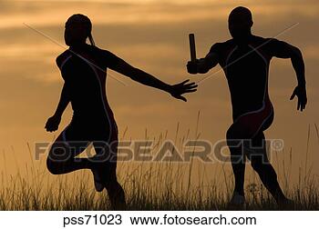 Stock Photo - male athletes 
running in relay 
race. fotosearch 
- search stock 
photos, pictures, 
images, and photo 
clipart