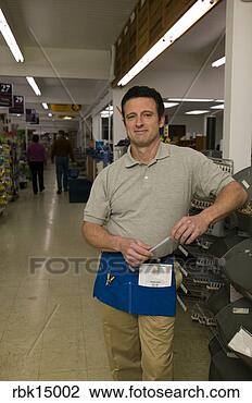 Stock Photo - male employee 
in hardware store. 
fotosearch - search 
stock photos, 
pictures, images, 
and photo clipart