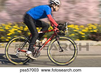 Stock Photo - man cycling. fotosearch 
- search stock 
photos, pictures, 
images, and photo 
clipart