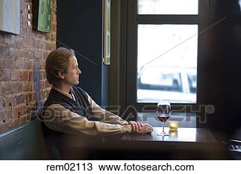 Stock Photo - man drinking wine 
at bar. fotosearch 
- search stock 
photos, pictures, 
images, and photo 
clipart