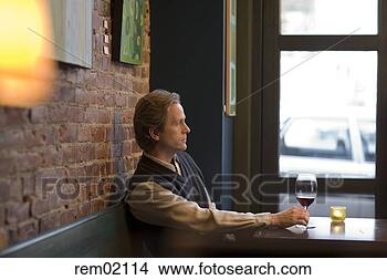 Stock Photo - man drinking wine 
at bar. fotosearch 
- search stock 
photos, pictures, 
images, and photo 
clipart