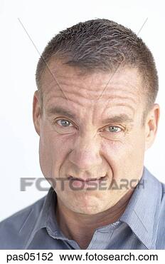 Stock Photo - man grimacing. 
fotosearch - search 
stock photos, 
pictures, images, 
and photo clipart