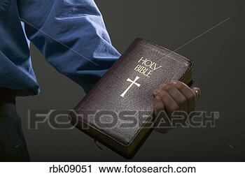 Stock Photography - man holding bible. 
fotosearch - search 
stock photos, 
pictures, images, 
and photo clipart