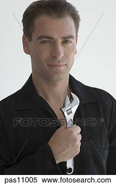 Stock Image - man holding monkey 
wrench. fotosearch 
- search stock 
photos, pictures, 
images, and photo 
clipart
