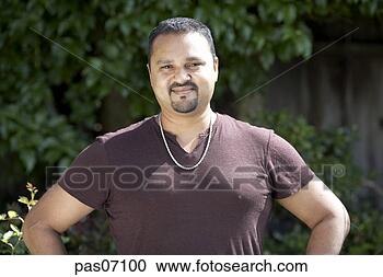 Stock Photography - man of indian 
ethnicity smiling. 
fotosearch - search 
stock photos, 
pictures, images, 
and photo clipart
