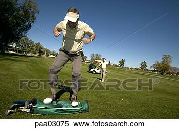 Stock Image - man jumping on 
golf bag. fotosearch 
- search stock 
photos, pictures, 
images, and photo 
clipart