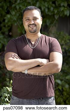 Stock Photo - man smiling and 
crossing arms. 
fotosearch - search 
stock photos, 
pictures, images, 
and photo clipart