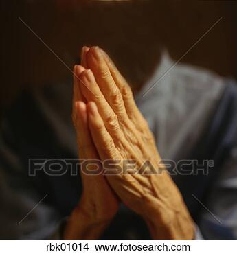 Stock Photo - mature woman praying. 
fotosearch - search 
stock photos, 
pictures, images, 
and photo clipart