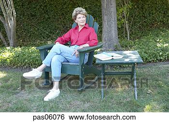 Stock Photo - middle-aged woman 
relaxing in backyard. 
fotosearch - search 
stock photos, 
pictures, images, 
and photo clipart