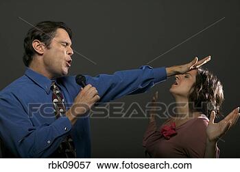 Picture - minister praying 
over parishioner. 
fotosearch - search 
stock photos, 
pictures, images, 
and photo clipart