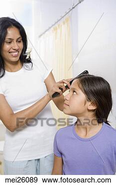 Stock Photograph - mother brushing 
her daughter’s 
hair. fotosearch 
- search stock 
photos, pictures, 
images, and photo 
clipart