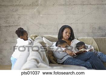 Picture - mother reading 
to her children 
on couch. fotosearch 
- search stock 
photos, pictures, 
images, and photo 
clipart