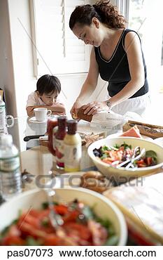 Stock Photo - mother setting 
table with son. 
fotosearch - search 
stock photos, 
pictures, images, 
and photo clipart