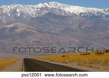Stock Photography - mountains and 
remote road. fotosearch 
- search stock 
photos, pictures, 
images, and photo 
clipart