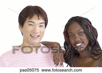 Stock Image - multi-ethnic couple 
smiling. fotosearch 
- search stock 
photos, pictures, 
images, and photo 
clipart