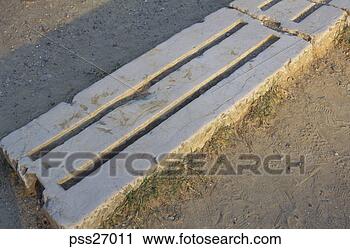 Stock Photography - old ruins of grooves 
in stone block. 
fotosearch - search 
stock photos, 
pictures, images, 
and photo clipart