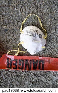 Stock Photo - overhead view 
of danger tape 
and protective 
mask. fotosearch 
- search stock 
photos, pictures, 
images, and photo 
clipart