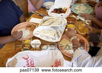 Stock Photograph - people eating 
indian take-out 
food. fotosearch 
- search stock 
photos, pictures, 
images, and photo 
clipart