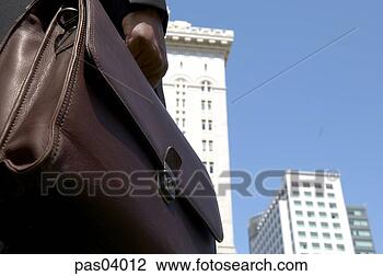 Stock Photo - person holding 
briefcase outdoors. 
fotosearch - search 
stock photos, 
pictures, images, 
and photo clipart