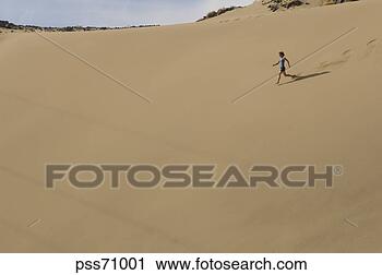 Stock Photography - person running 
down sand dune. 
fotosearch - search 
stock photos, 
pictures, images, 
and photo clipart