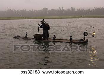 Stock Photo - person wearing 
conical hat, pushing 
 wooden raft with 
pole. fotosearch 
- search stock 
photos, pictures, 
images, and photo 
clipart