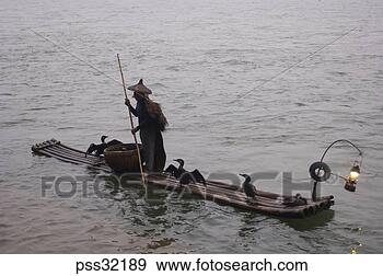 Stock Photograph - person wearing 
conical hat, pushing 
 wooden raft with 
pole. fotosearch 
- search stock 
photos, pictures, 
images, and photo 
clipart