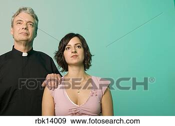 Stock Photograph - priest with hand 
on woman’s shoulder. 
fotosearch - search 
stock photos, 
pictures, images, 
and photo clipart