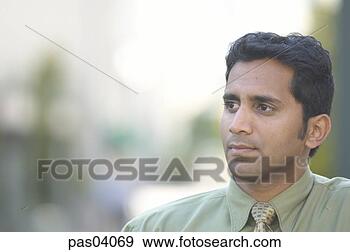 Stock Photograph - serious hispanic 
businessman. fotosearch 
- search stock 
photos, pictures, 
images, and photo 
clipart