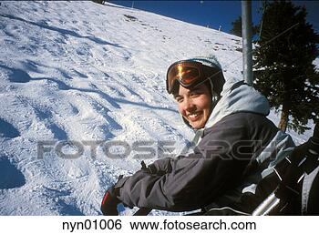 Stock Photo - skier riding ski 
lift. fotosearch 
- search stock 
photos, pictures, 
images, and photo 
clipart