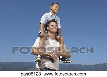 Stock Photo - son riding on 
father’s shoulders. 
fotosearch - search 
stock photos, 
pictures, images, 
and photo clipart