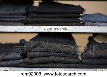 Stock Photo - stacks of jeans 
on shelf in clothing 
store. fotosearch 
- search stock 
photos, pictures, 
images, and photo 
clipart