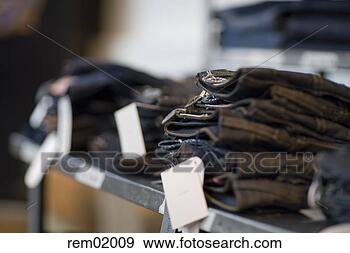 Stock Photograph - stacks of jeans 
on shelf in clothing 
store. fotosearch 
- search stock 
photos, pictures, 
images, and photo 
clipart