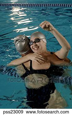 Stock Photograph - swimmers celebrating 
success in swimming 
pool. fotosearch 
- search stock 
photos, pictures, 
images, and photo 
clipart