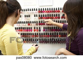 Stock Photography - teen girls selecting 
nail polish. fotosearch 
- search stock 
photos, pictures, 
images, and photo 
clipart