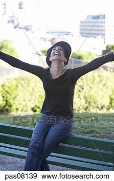 Stock Photograph - teenage girl sitting 
on bench. fotosearch 
- search stock 
photos, pictures, 
images, and photo 
clipart