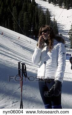Stock Photo - teenage girl talking 
on cell phone 
on ski slopes. 
fotosearch - search 
stock photos, 
pictures, images, 
and photo clipart
