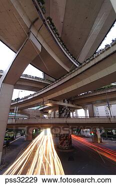 Stock Photograph - timed exposure 
of traffic under 
raised highway. 
fotosearch - search 
stock photos, 
pictures, images, 
and photo clipart