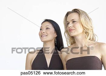 Stock Photo - two women standing 
together. fotosearch 
- search stock 
photos, pictures, 
images, and photo 
clipart
