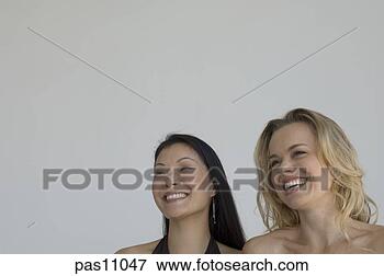 Picture - two women standing 
together. fotosearch 
- search stock 
photos, pictures, 
images, and photo 
clipart