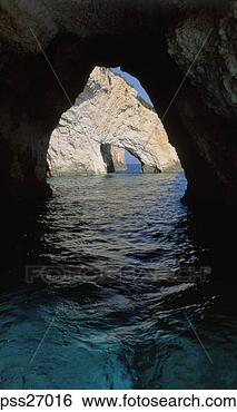 Stock Photo - view of sea through 
natural rock archways. 
fotosearch - search 
stock photos, 
pictures, images, 
and photo clipart