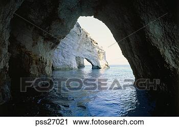 Stock Photography - view of sea through 
natural rock archways. 
fotosearch - search 
stock photos, 
pictures, images, 
and photo clipart