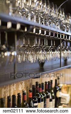 Stock Photography - wine glasses on 
shelf behind bar 
counter. fotosearch 
- search stock 
photos, pictures, 
images, and photo 
clipart