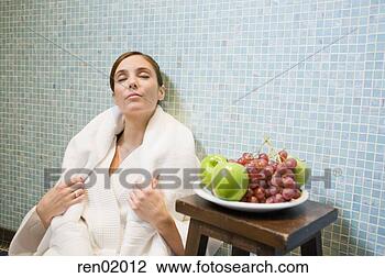 Stock Photo - woman in bathrobe 
leaning on tile 
wall. fotosearch 
- search stock 
photos, pictures, 
images, and photo 
clipart