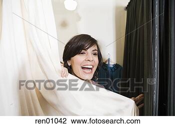 Stock Photo - woman behind fitting 
room curtain. 
fotosearch - search 
stock photos, 
pictures, images, 
and photo clipart
